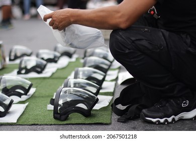 Bangkok, Thailand-31 Oct 2021: Face Shield For Sale On The Street Call For Reforms To Monarchy, Abolish Lèse-majesté Section 112 On  Ratchaprasong Intersection.