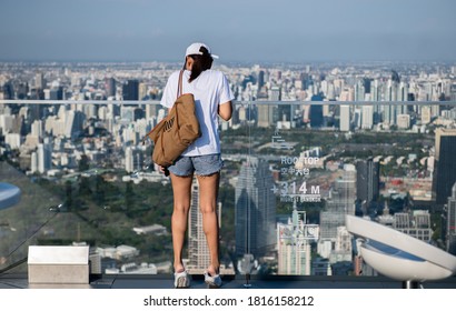 BANGKOK THAILAND-Apr 17:The Unknow Female Tourist Looking Down The City View From Top Of Mahanakhon Building On Apr 17,2019 In Bangkok Thailand.