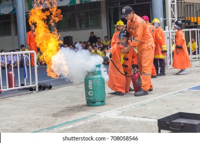 BANGKOK, THAILAND-AUGUST 18,2017: Many People Preparedness For Fire Drill And Training To Use A Fire Safety Tank In The School.