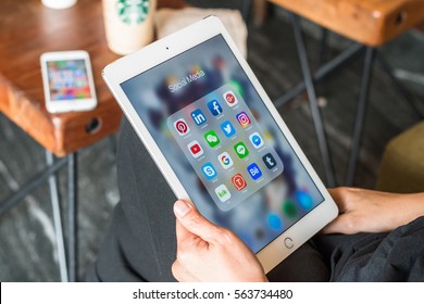 BANGKOK, THAILAND-January 22, 2017: Social Media App Icons On Ipad, Iphone 7 Smart Phone Touchscreen Mobile Internet Technology Lifestyle In Digital Age.