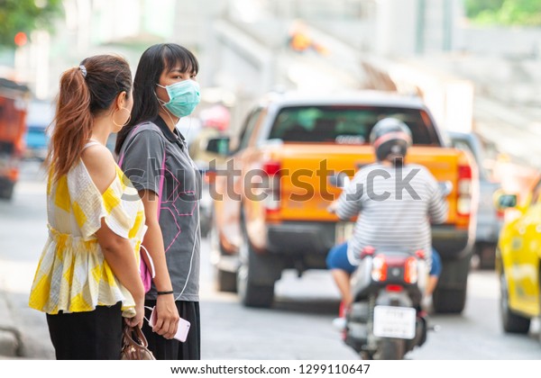 Bangkok,\
Thailand-January 26, 2019: Unidentified woman wearing anti\
pollution masks and small dust in\
Thailand.