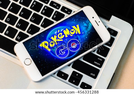 BANGKOK, THAILAND-July 22, 2016: Smart phone gadget with screen showing application Pokemon Go mobile game app developed by Niantic for iOS and Android devices now launching around the world