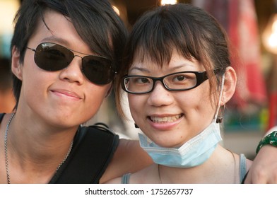 BANGKOK, THAILAND-MAY 11,2020: Young Thai Millenials Couple  People Pose For A Portrait In Bangkok During Covid, She Wears Mask