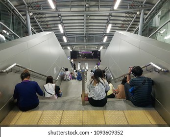 Bangkok Thailand-MAY 18-2018;People Sit And Wait For Rain To Stop At Tao Poon MRT Station With Mass Rapid Transit Authority Of Thailand