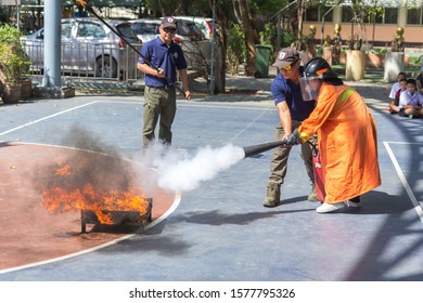 BANGKOK, THAILAND-NOVEMBER 20,2019: Many People Preparedness For Fire Drill And Training To Use A Fire Safety Tank In The School.