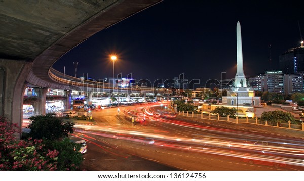 BANGKOK-APR 19: Military victory monument and\
elevated railway at twilight on April 19, 2013 in Bangkok,\
Thailand. Monument, built in 1941, demonstrates a victory sign of\
war with France.