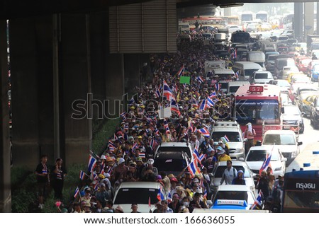 BANGKOK-DECEMBER 9 : Anti-government protesters rally outside Government House on DECEMBER  9 ,2013 in Bangkok, Thailand. The movement is known as the People's Democratic Force to Overthrow Thaksinism