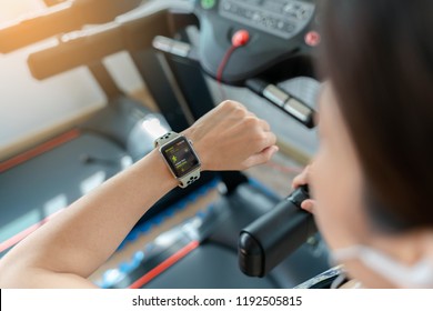 Bangkok,Thailand ,1 Oct 2018 : Close Up Of Apple Watch Indoor Walk App Young Woman Ready Running Workout Electric Treadmill In Gym