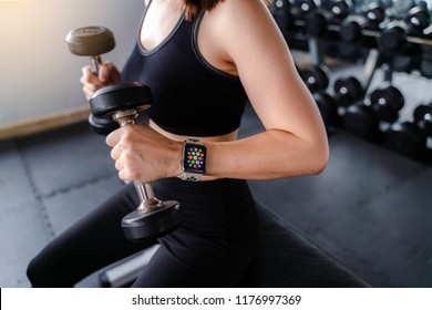 Bangkok,Thailand ,11 Sep 2018 : Close Up Of Apple Watch Home Apps View Young Asia Woman Dumbbell Workout Fitness Gym