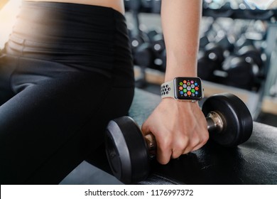 Bangkok,Thailand ,11 Sep 2018 : Close Up Of Apple Watch Home Apps Screen View Woman Dumbbell Workout Fitness Gym