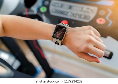 Bangkok,Thailand ,11 Sep 2018 : Close Up Of Apple Watch Heart Rate App View Young Asia Woman Running Workout Electric Treadmill Fitness Gym