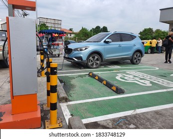 Bangkok,Thailand 13 Oct 2020:Photo Of An Electric Car MG ZS EV Blue Parked Charger Of The Metropolitan Electricity Authority At The Charging Station Without Charge, Electric Charging Service For Free