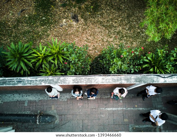 bangkok/Thailand\
April 4, 2019 : High angle view of workers between standing waiting\
for a car to go to work in the\
morning