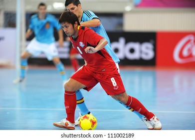 BANGKOK,THAILAND AUGUST24:Jetsada Chudech (red) Of Thailand In Action During Friendly Match Between Thailand And Spain At Nimibutr Stadium On August24,2012 In Bangkok Thailand