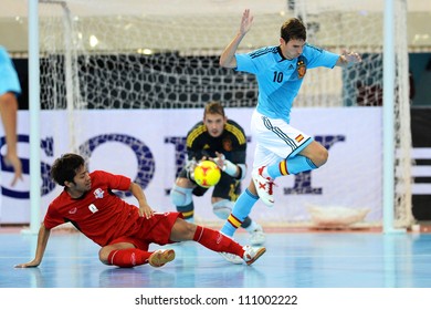 BANGKOK,THAILAND AUGUST24:Jetsada Chudech (red) Of Thailand In Action During Friendly Match Between Thailand And Spain At Nimibutr Stadium On August24,2012 In Bangkok Thailand