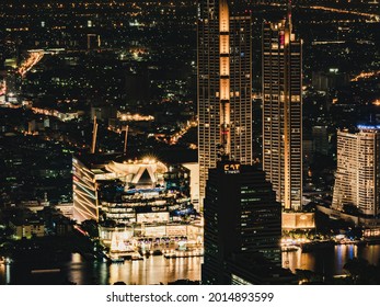 Bangkok,Thailand - Dec 31 2020 Iconsiam famous shopping center Cityscape Bangkok downtown at night, from the top of King Power Mahanakhon ,Thailand. long exposure,Blur focus