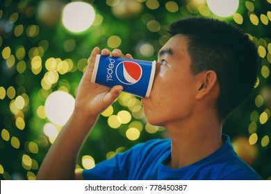 Bangkok,Thailand - December ,2017 : Unidentified Man Drinking Pepsi Cup
