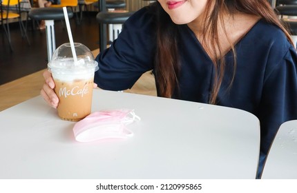 BANGKOK,THAILAND - JANUARY 20,2022 : Women Drinking Coffee At Mc Cafe.