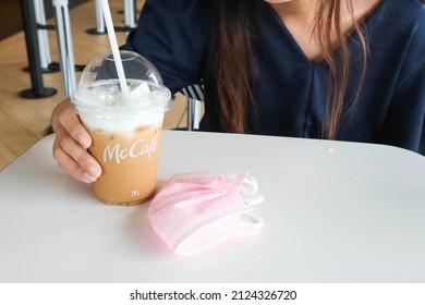 BANGKOK,THAILAND - JANUARY 20,2022 : Women Drinking Coffee At Mc Cafe.