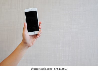 Bangkok,Thailand - July 8,2017 : close up woman hand holding turn off of iphone smartphone with copy space for design,promote product element,technology concept