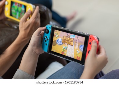 Bangkok,Thailand - May 30, 2020: Animal crossing game popular Nintendo switch with joy controllers family friend activity playing together.