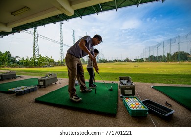 Bangkok,Thailand - Nov 4 2017: Kid Lerning How To Play Golf At Driving Range.