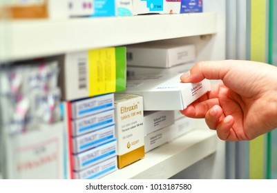 Bangkok,Thailand - November 15, 2017:Closeup Pharmacist Hand Holding Medicine Box In Pharmacy Drugstore. 