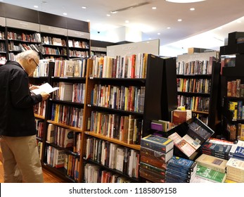 Bangkok/Thailand September 16 2018:the old man is reading in the book shop. - Shutterstock ID 1185809158