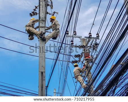 bangkokthailand september 3 line installers repairers stock photo electrical power line installers and repairers