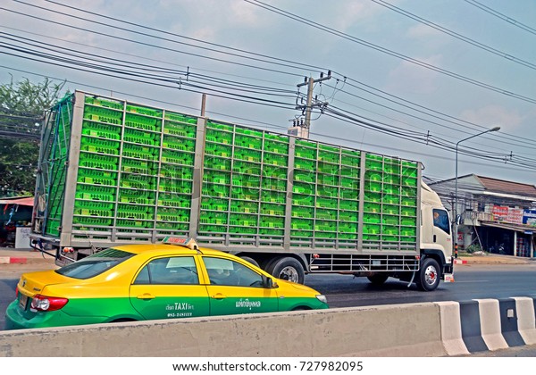 BANGKOK-THAILAND-APRIL 19 : The\
transportation truck on the road in the city, April 19, 2016\
Bangkok,\
Thailand