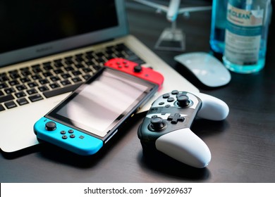 Bangkok,Thailand-April,9,2020: Nintendo Switch Consoles , Gaming Controller On Desk Office  