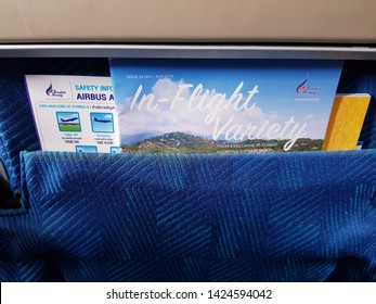 Bangkok,Thailand-Circa June 2019: Inflight magazine and safety information puts in pocket in front of passenger seat on Bangkok Airways at day flight. 