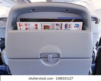 Bangkok,Thailand-Circa November 2019: Back seat of passenger on Bangkok Airways sets up with information pocket keeping safety instruction and magazine in flight service.