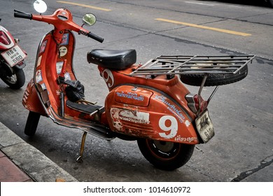 Bangkok,Thailand,January 23 2018 : Orange Classic Vespa Motor Bike On The Street In Leather Market,Vintage Scooter                               