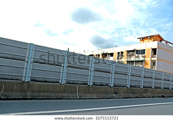 BANGKOK-THAILAND-JULY 15 : Noise barrier on\
highway in the city, July 15, 2016 Bangkok,\
Thailand