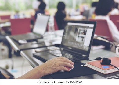 BANGKOK,THAILAND-JULY 16,2017: Dramatic Tone Of Computer Screen Full With Folder.The People  Using  Notebook In The Beginning Photoshop Class . JULY.16.2017.