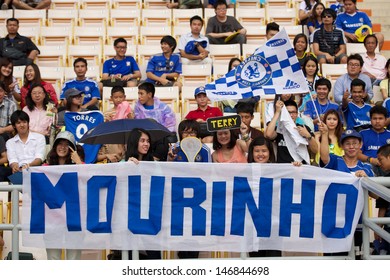 BANGKOK,THAILAND-JULY 16:Unidentified Thai fans hold banner supporters  during a Chelsea FC training session at Rajamangala Stadium on July 16, 2013 in Bangkok, Thailand.