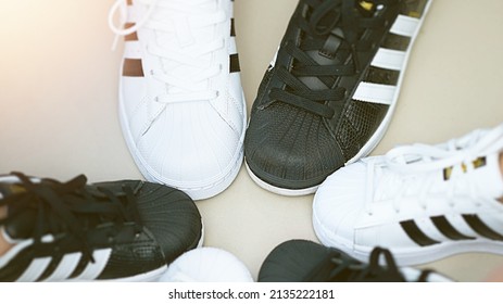 Bangkok,Thailand,July 18,2018-Pairs of black and white color sneaker adidas shoes in three  sizes.jpg