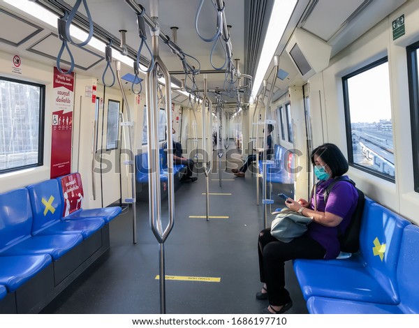 BANGKOK/THAILAND-Mar 29, 2020:\
Measure against COVID-19.Social distancing inside a MRT subway\
train. Yellow cross symbol on a seat means one shall not sit\
there.Infection\
control.