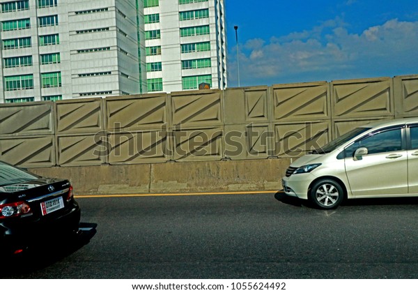 BANGKOK-THAILAND-MARCH 19 : The Noise\
barrier on the highway in the city, March 19, 2018 Bangkok,\
Thailand