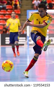 BANGKOK,THAILAND-NOV18: Yeisson Fonnegra  (yellow ) Of Colombia Shoot The Ball During The FIFA Futsal World Cup  Between Italy And Colombia At Indoor Stadium Huamark On Nov18,2012 In,Thailand.