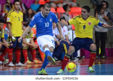 BANGKOK,THAILAND-NOV18:Jairo Dos Santos (blue) Of Italy Control The Ball During The FIFA Futsal World Cup  Between Italy And Colombia At Indoor Stadium Huamark On Nov18,2012 In,Thailand.