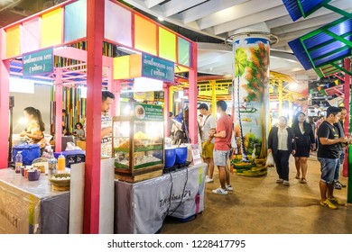 BANGKOK,THAILAND-November 2018-People And Tourist Walking, Eating, Buying Food At Indoor Street Food Market Festival. Market Stalls. Indoor Market . Food Event. Food Fair. Festival. Concert. Shopping 