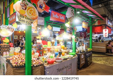 BANGKOK,THAILAND-November 2018-People And Tourist Walking, Eating, Buying Food At Indoor Street Food Market Festival. Market Stalls. Indoor Market . Food Event. Food Fair. Festival. Concert. Shopping 