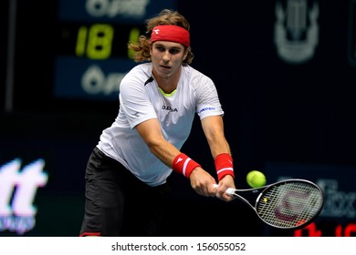 BANGKOK,THAILAND-SEP 24:Lukas Lacko Of Slovakia  Returns Ball During Match Against Alejandro Falla Of Colombia At Thailand Open On September24, 2013 At Impact Arena,Bangkok,Thailand 