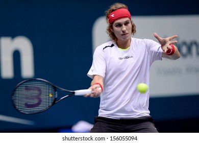 BANGKOK,THAILAND-SEP 24:Lukas Lacko Of Slovakia Returns Ball During Match Against Alejandro Falla Of Colombia At Thailand Open On September24, 2013 At Impact Arena,Bangkok,Thailand 