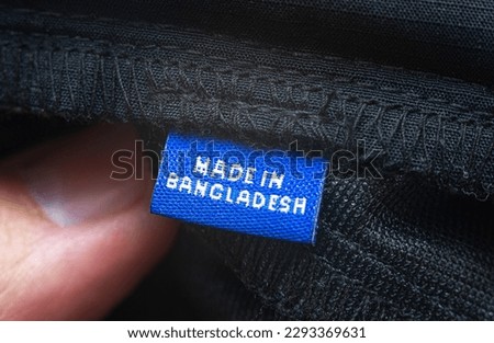 Bangladesh clothing tag. Close-up, selective focus.