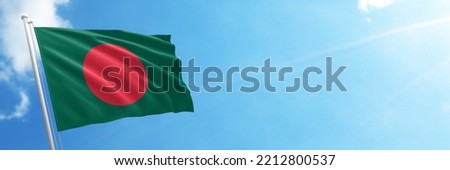 Bangladesh flag in the blue sky. Horizontal panoramic banner.