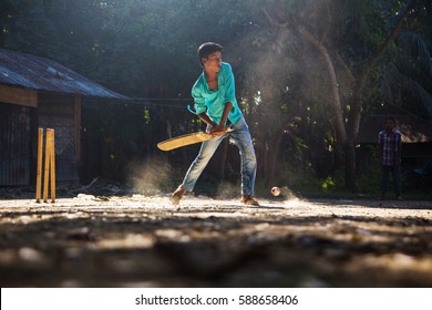 Bangladesh - Oct 08, 2013: Boys Playing Cricket