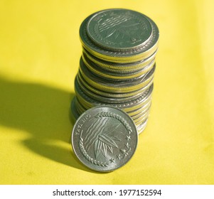 Bangladeshi Taka Coin Over Yellow Background